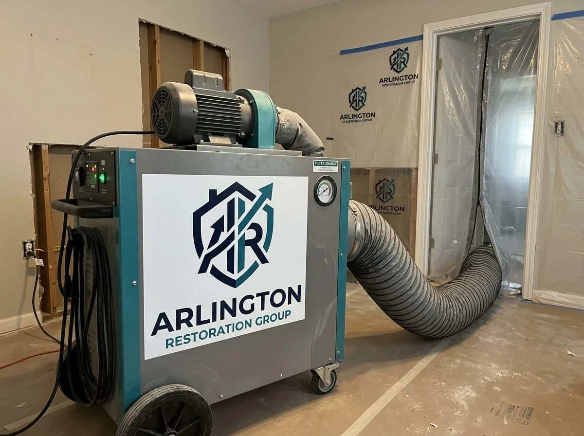 HEPA air scrubber running in a room affected by a sewage backup to help manage air quality during cleanup